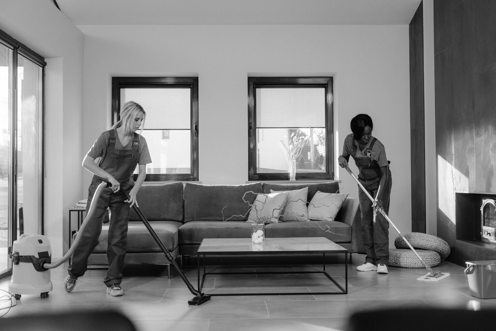 women cleaning inside of a house